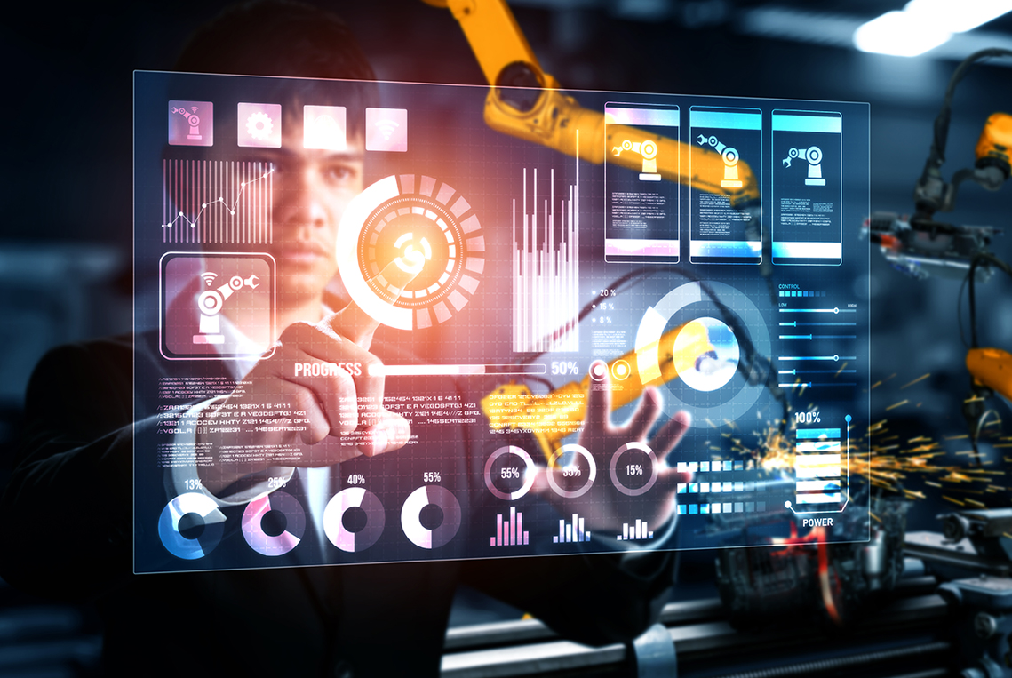 A portrait of an industrial man and woman engineer with laptop in a factory, working. Manufacturing